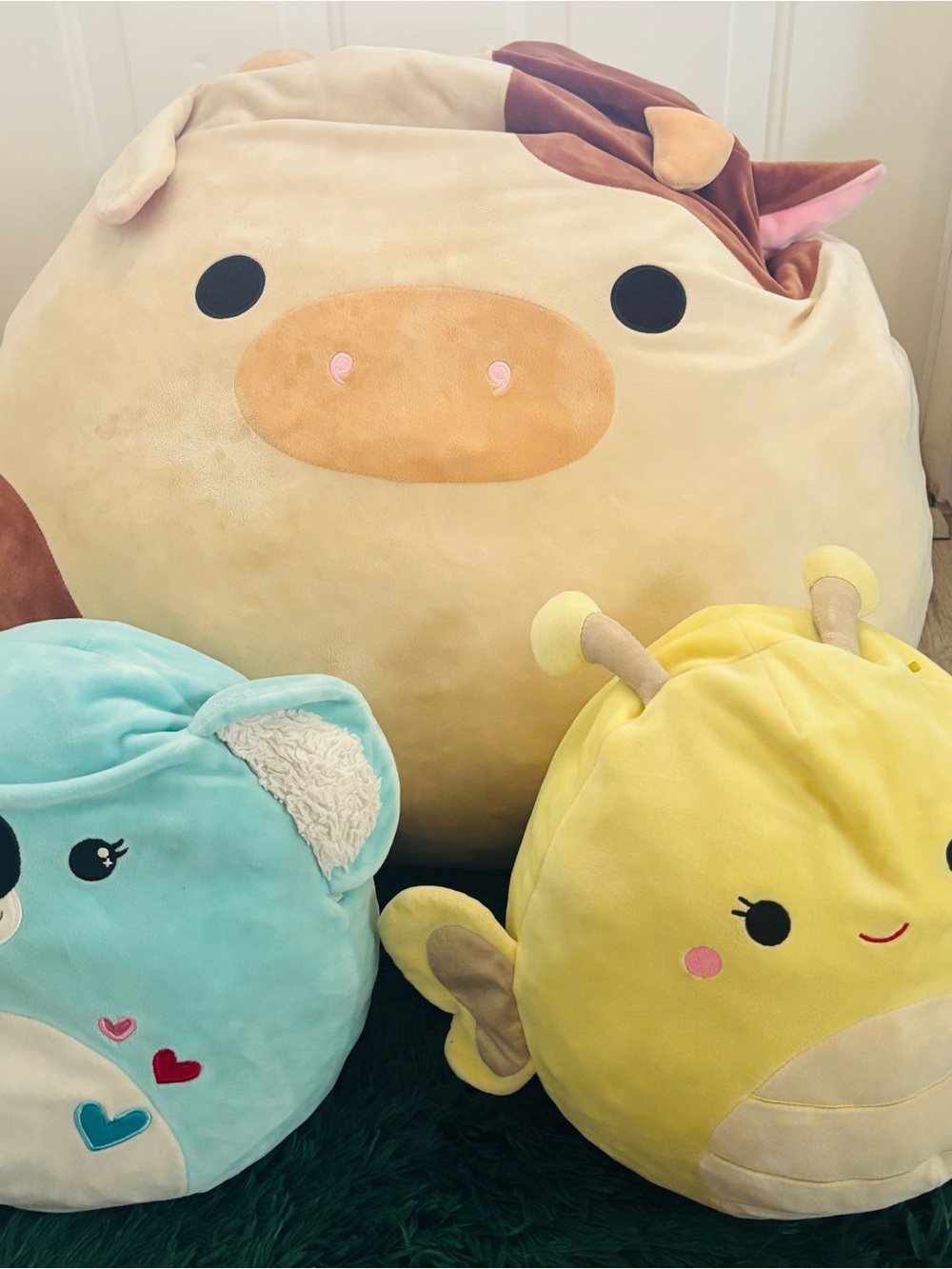 Three Squishmallows, the cow rare and hard to find